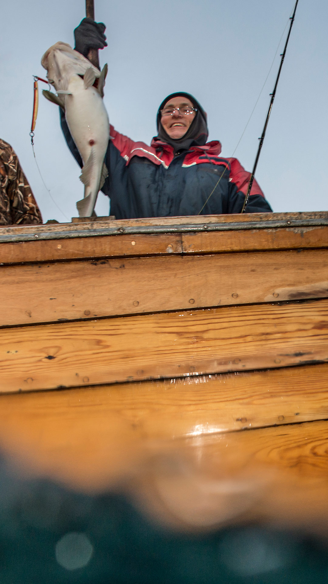 detail of fisherman on traditional fishing boat, Norway (c) vasco pinhol
